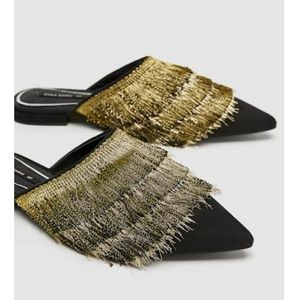 Flat mules with fringe OFFER IT NOW